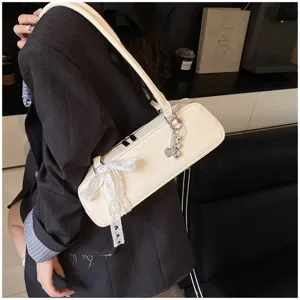 Elegant cream white baguette shoulder bag with cute lace bow and charm for women daily fashion style