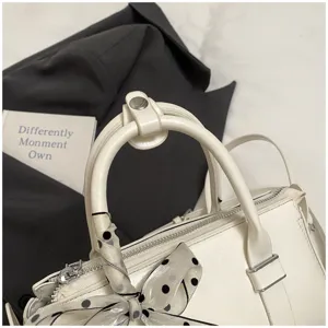 White PU leather shoulder handbag with stylish polka dot ribbon, retro casual commuting bag.