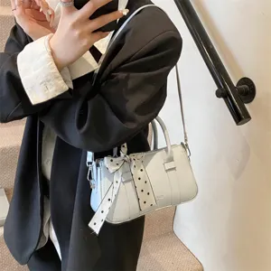 Chic light blue top handle handbag for women, retro casual commuter shoulder crossbody bag.
