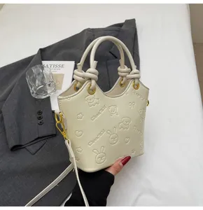 Close-up detail of retro bucket bag with cute embossed animal patterns, stylish and chic.