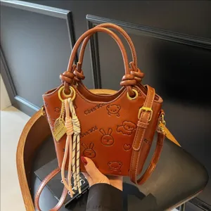Retro Casual PU Leather Bucket Bag Women 2025 Spring Summer Fashion Embossed Shoulder Crossbody Bag With Pendant