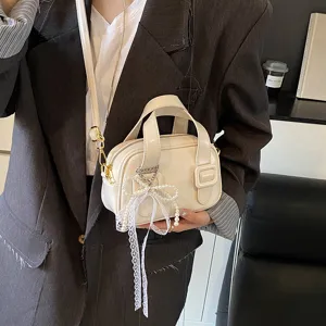 White soft leather handbag for women, stylish crossbody shoulder pillow bag with pearl lace bow.