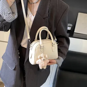 Minimalist soft leather bowling shoulder bag for women, stylish daily crossbody handbag.