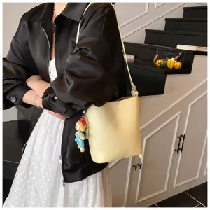 Stylish yellow bucket bag for women, trendy solid color casual shoulder crossbody bag daily use.