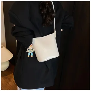 Women fashion solid color bucket bag casual shoulder crossbody bag with cute doll pendant