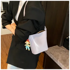 Stylish minimalist purple bucket bag for women, trendy PU leather casual crossbody shoulder bag.