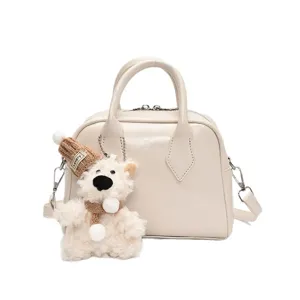 Soft leather bowling bag for women, stylish handbag with cute bear pendant for daily commuting.