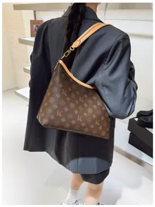 Stylish large capacity shoulder underarm bag for women, retro monogram print with leather trim.