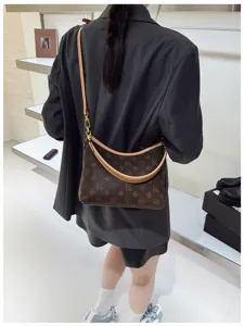 Detail view of the brown monogram shoulder bag, stylish casual crossbody underarm bag for women.