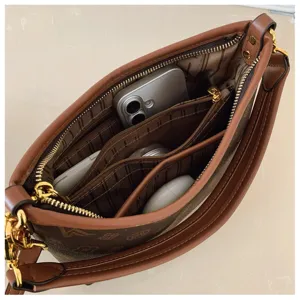 Stylish women's brown monogram shoulder bag with multi-compartments and structured design.