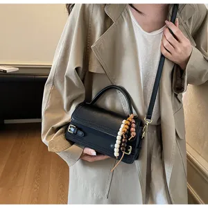 Chic black mini square shoulder bag for women, premium PU leather crossbody handbag with beads.