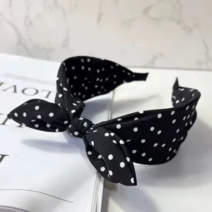 Retro minimalist black and white polka dot bow headband, chic wide brim hair accessory.