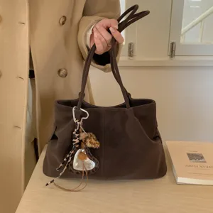Retro suede tote bag for women, large capacity commuter shoulder handbag with charm.