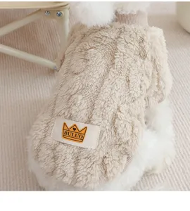 Detailed close-up of cozy beige fleece pet dog sweater showing soft fabric and cute crown label.