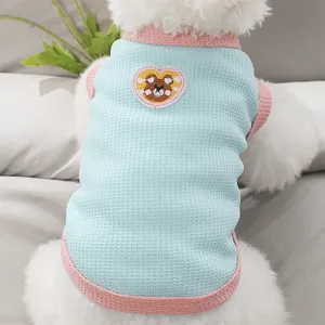 Detailed shot of a cute summer pet vest with cute bear embroidery and waffle knit design.