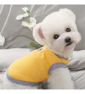 Detailed view of a breathable summer dog vest in bright yellow, perfect for small pets.