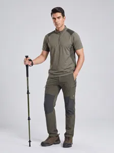 Professional outdoor trekking pole with telescopic design, paired with durable hiking gear.