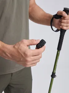 Lightweight trekking pole with anti-slip grip and adjustable wrist strap for outdoor hiking.