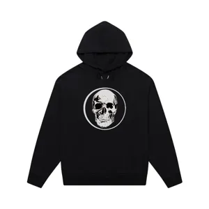 Black hooded sweatshirt featuring a bold white skull graphic on the chest, relaxed streetwear style.