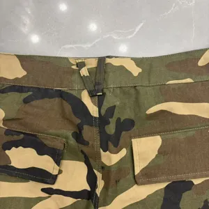 Camouflage cargo shorts detail view showing back pockets and tactical style for streetwear fashion.
