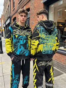 Men streetwear zip hoodie and matching sweatpants tracksuit set with graphic print.