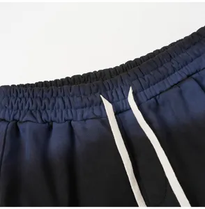 Gradient drawstring shorts detail view, casual streetwear style with adjustable waistband.