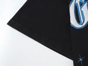 Black washed short sleeve t-shirt detail, vintage streetwear style with graphic print.