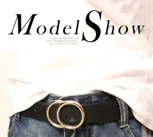 Minimalist double ring leather belt detail showing the stylish metal buckle and black strap.