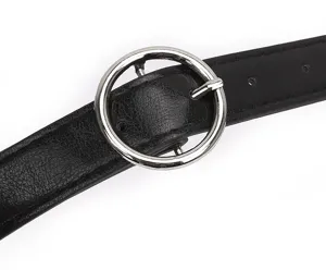 Close-up view of a women's black leather belt featuring a sleek silver round metal buckle.