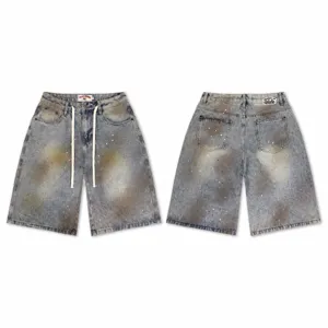 High street washed denim shorts with number embroidery and paint splatter effect for men and women.
