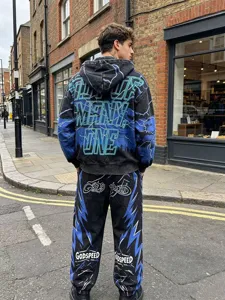 Vintage washed streetwear hoodie and sweatpants set with blue lightning and letter print.