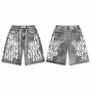 High-street washed denim shorts with gothic number patch embroidery and splatter paint.