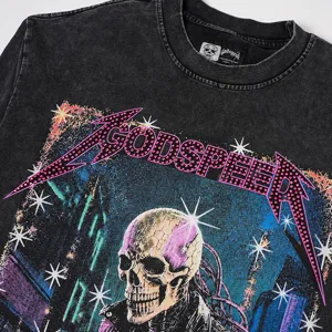 Close-up of washed distressed long sleeve t-shirt featuring rhinestone skull graphic.