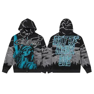 Detailed view of the black zip-up hoodie featuring graphic print and lightning details.