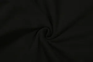 Close up detail view of premium black ribbed fabric showing fine knit texture clearly.
