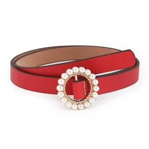 Detail shot of red PU leather women belt featuring elegant round pearl decorative buckle.