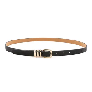 Detail shot of a black thin PU leather women waist belt with elegant gold buckle and rings.