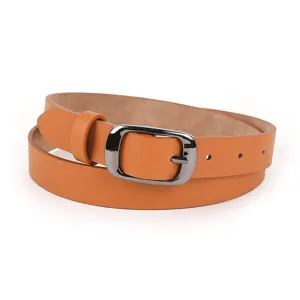 Close up of a classic brown leather women belt with metal buckle, stylish and minimal accessory.