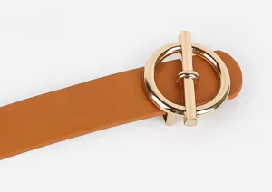 Close-up of brown PU leather women's belt featuring a polished gold-tone metal round buckle.