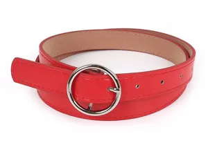 Close up view of red leather belt with shiny round silver metal buckle fashion accessory