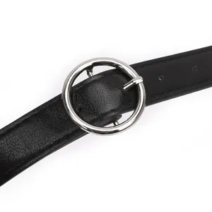 Women's black casual leather belt with silver round metal buckle for stylish jeans.