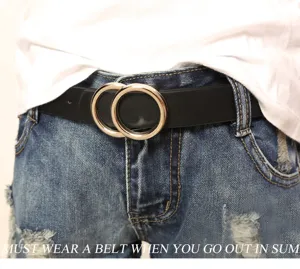 Close-up of minimalist black leather belt with double metal rings, stylish casual waist accessory.