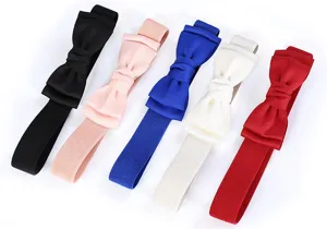 Close up detail of multi color elastic bow waist belts for women dress decoration.