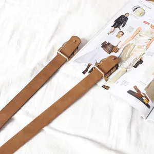 Minimalist brown suede belt with metal ring buckle, stylish casual accessory for women.
