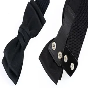 Women elastic bow belt detail view, stylish black waist cincher with metal snap buttons.