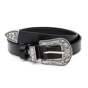 Retro women PU leather belt with vintage floral engraved metal buckle and tip design details.