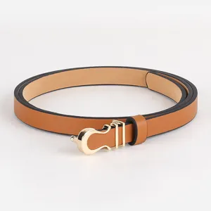 Detail view of women's thin leather belt featuring a sleek gold metal buckle and loop.