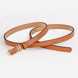 Detailed view of a slim brown leather belt with a chic gold metal buckle for dresses.