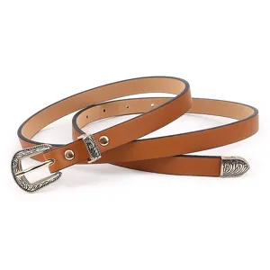 Brown thin PU leather belt featuring vintage engraved metal buckle, loop and tip detail.