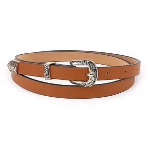 Vintage brown PU leather belt for women with intricate carved silver metal buckle and tip.